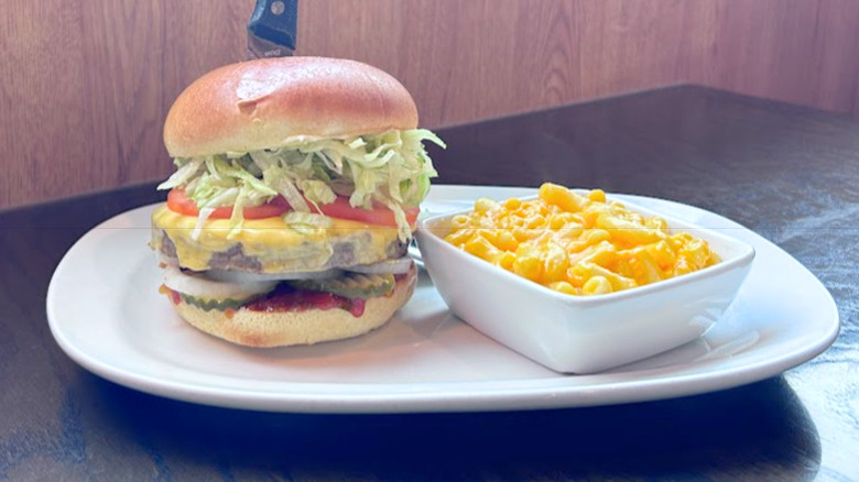 Red Robin's Impossible Burger on a white plate next to a side of mac n' cheese