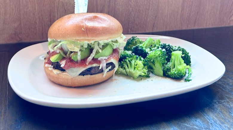 Red Robin's Veggie Burger and broccoli on a white plate