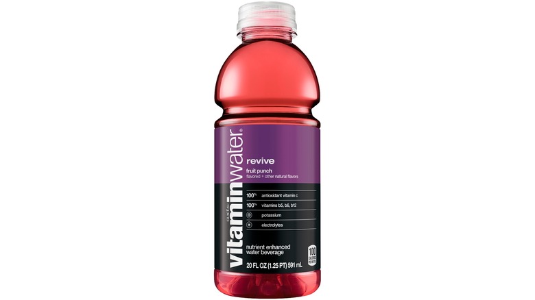 Six bottles of Vitaminwater Revive against a white background