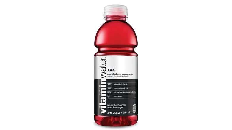 Six bottles of Vitaminwater XXX against a white background