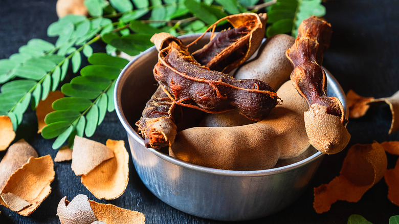 tamarind sauce in bowl, tamarind pods
