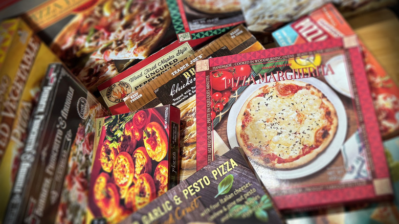Pile of frozen pizza boxes