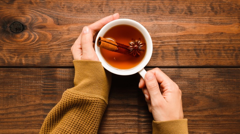 Woman holding mug of tea