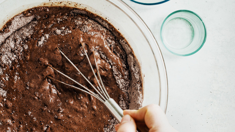 Whisking chocolate cake batter