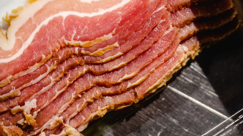 Slices of raw bacon