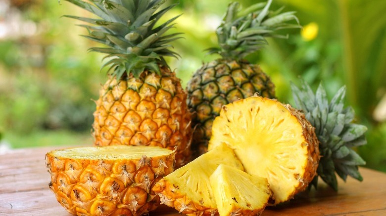 Whole pineapple sliced in half