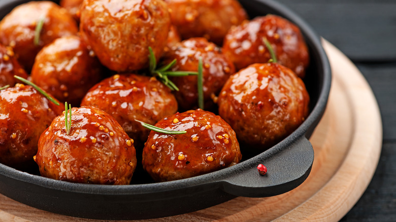 Glazed meatballs in cast iron dish