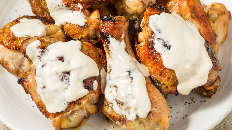 Alabama white sauce on chicken wings and thighs