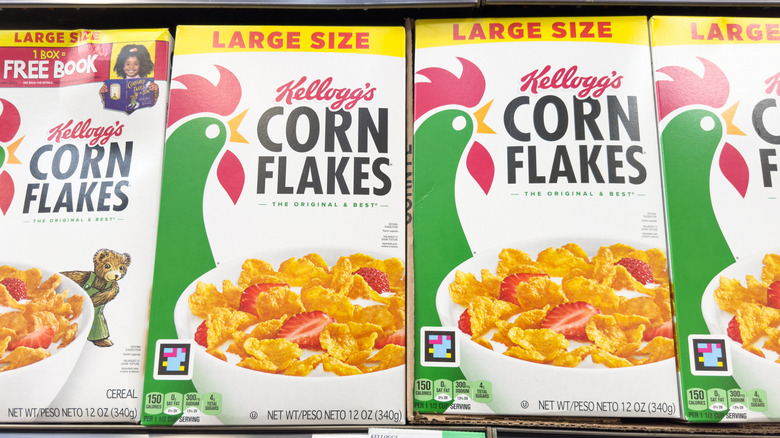 Boxes of Kellogg's Corn Flakes on a grocery store shelf