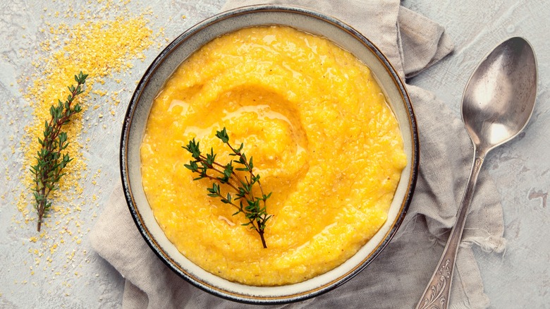 garnished cooked polenta in bowl