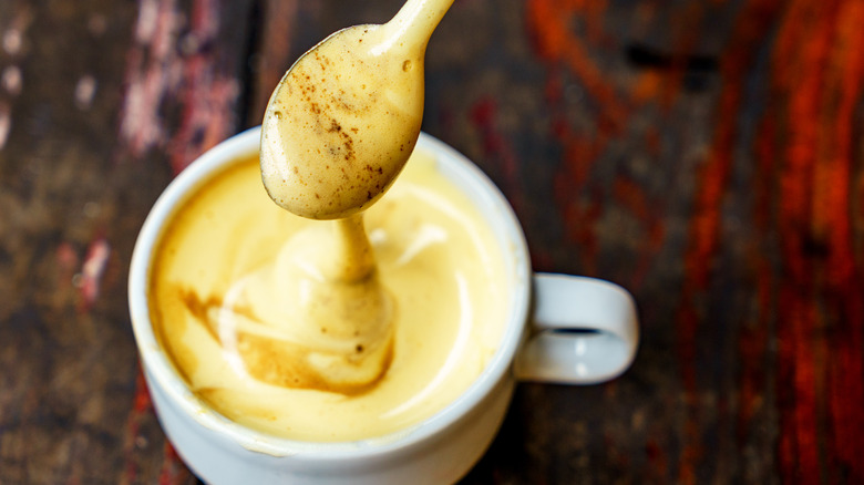 Spoon dipped into Vietnamese egg coffee 