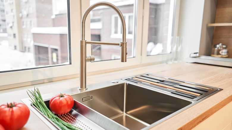 A clean, shiny kitchen faucet