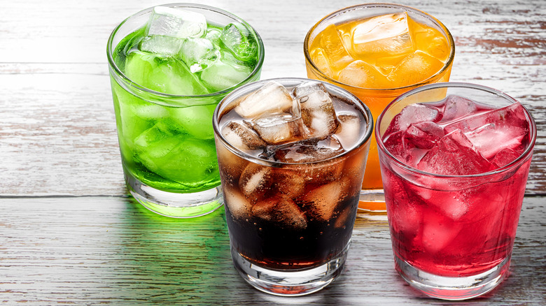 Assorted soda flavors on a rustic table