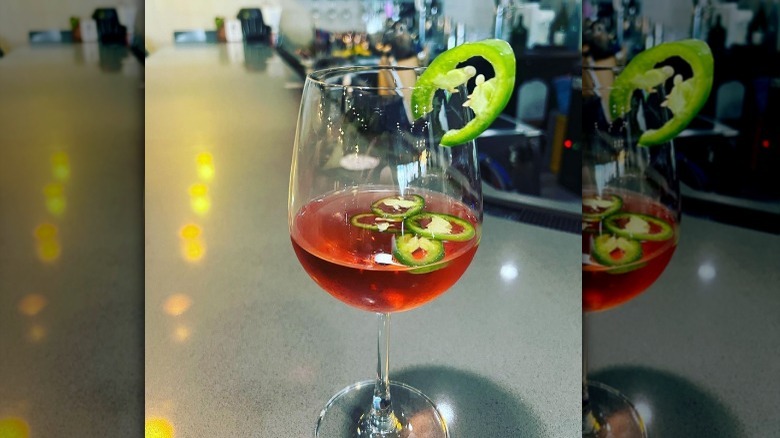 Glass of rosé with jalapeño slices