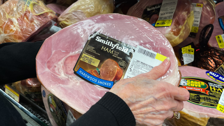 Hands holding a hunk of Smithfield Ham