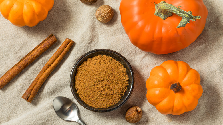 Whole pumpkins and spices