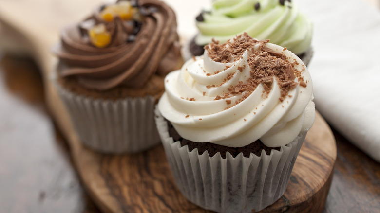 Chocolate cupcakes on wood board