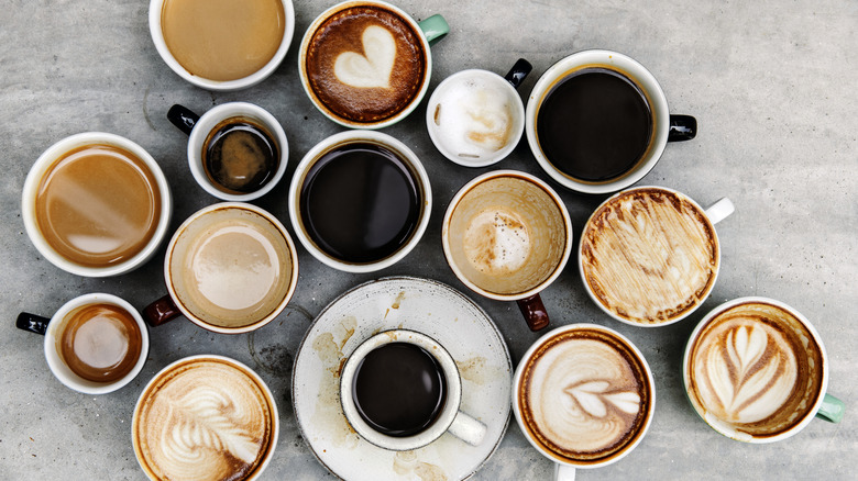 Cups of various shapes and sizes showcasing coffee menu