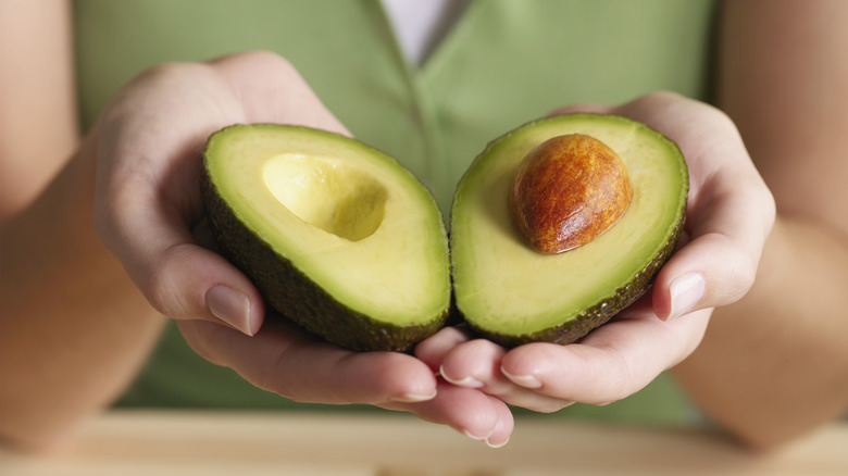 Ripe avocado cut to expose the pit