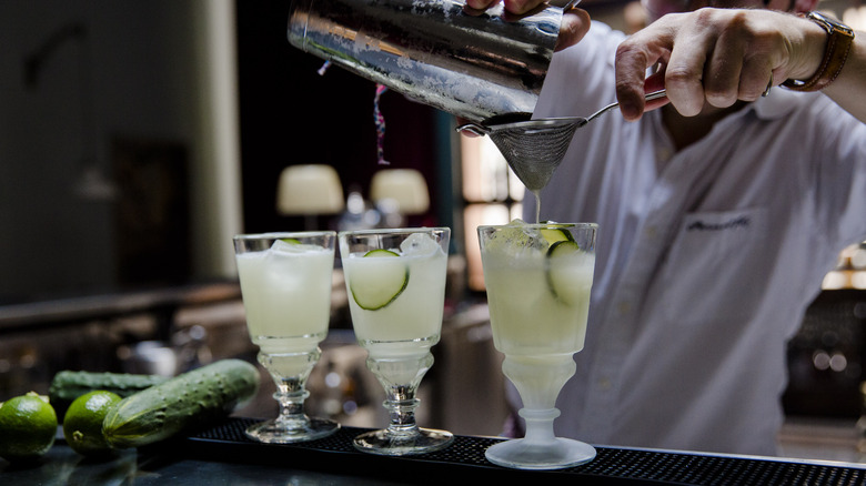 bartender mixing absinthe cocktails