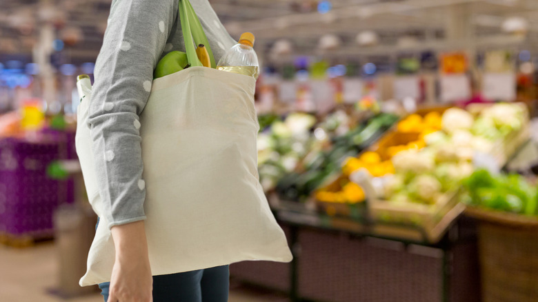 Woman shopping with reusable bag 