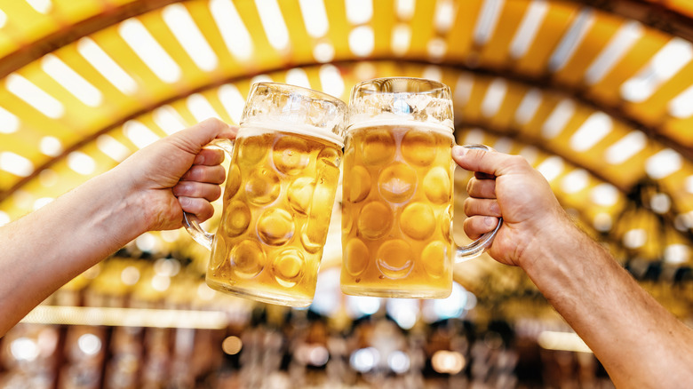 Beer steins clinking together