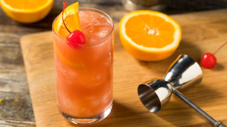 Sex on the beach cocktail with a cherry and orange wedge garnish