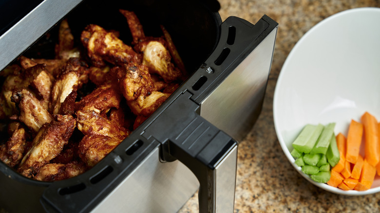 Chicken wings in air fryer basket