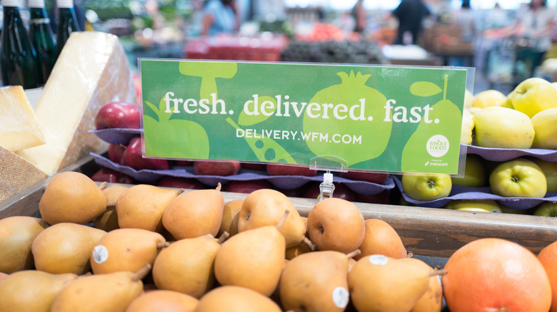 Close-up on Whole Foods delivery sign