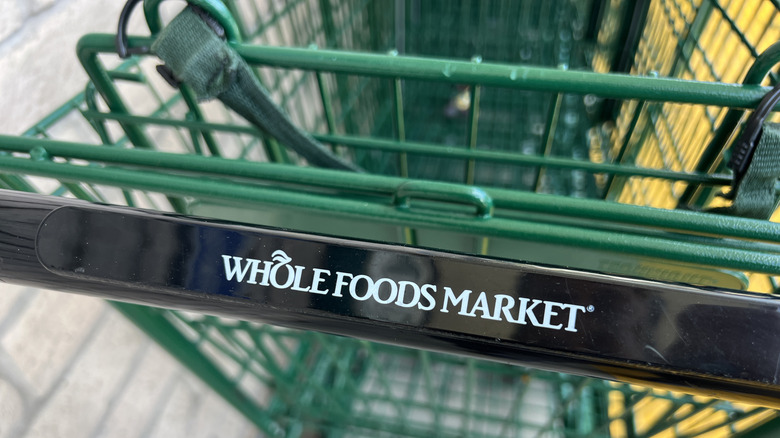 Close-up view of a Whole Foods shopping cart