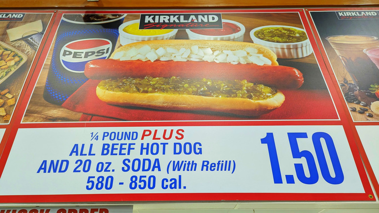 a view looking up at the Costco food court display menu showing the price of a hot dog and soda combo