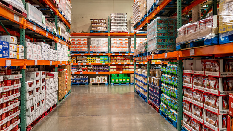 a view down a Costco aisle with stacks of items