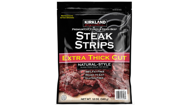 a pack of Kirkland Signature Steak Strips against a white background