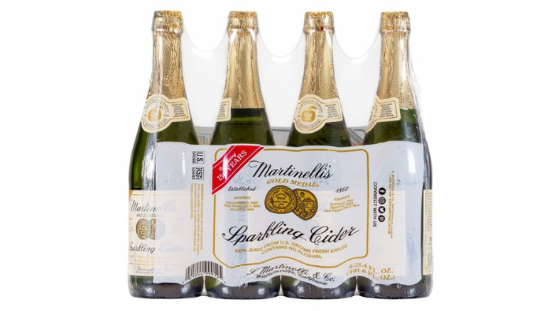 a four-pack of Martinelli's sparkling cider against a white background