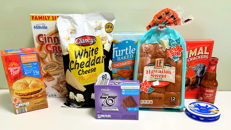 Various Aldi Dupes lined up together on a green and white background