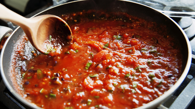 Stirring tomato sauce
