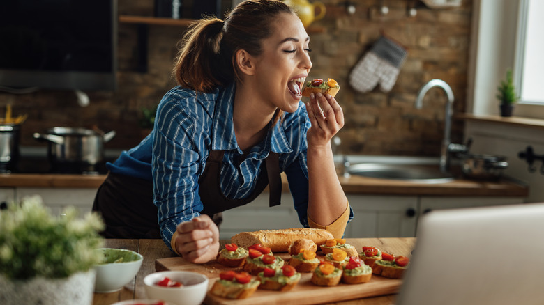 A chef samples her creation