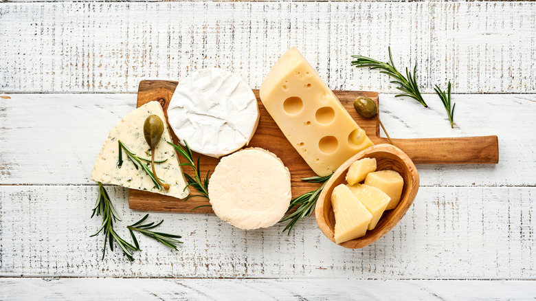 Assortment of cheeses on board