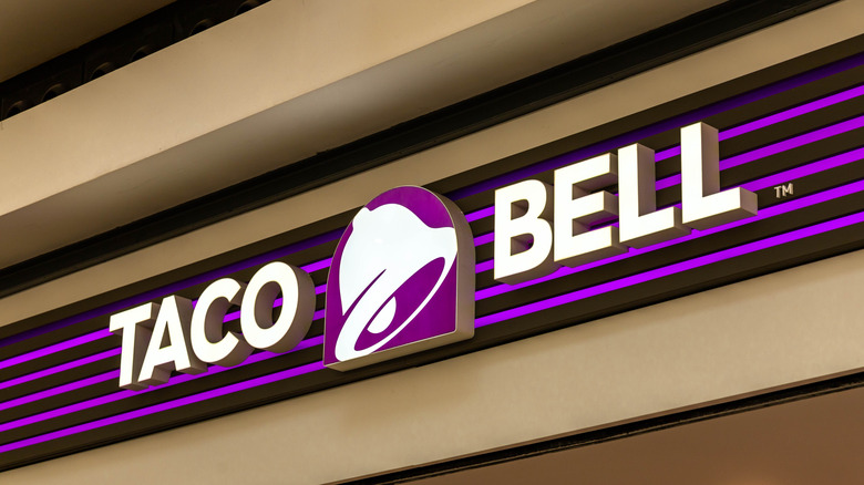 A modern, purple and white sign for Taco Bell