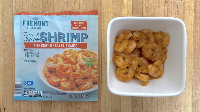 Fremont Fish Market's Chipotle Sea Salt Toss & Serve Shrimp in bowl next to empty product bag