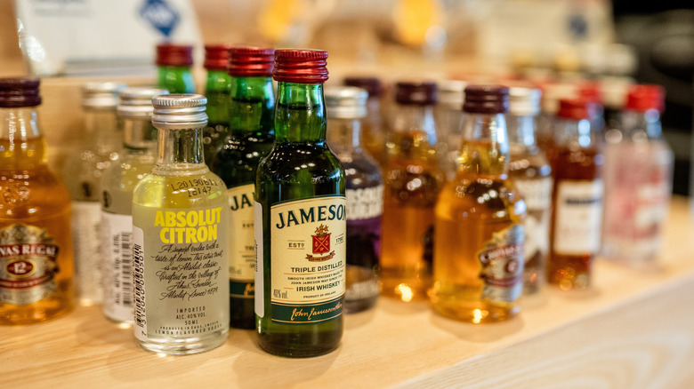 An assortment of mini liquor bottles on a shelf
