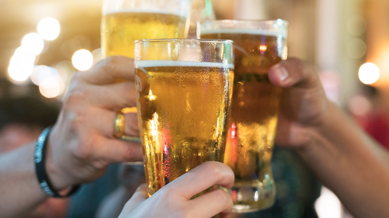 People toasting with beer