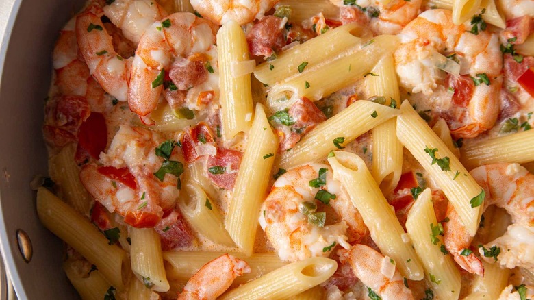 creamy pasta with shrimp and pico de gallo closeup
