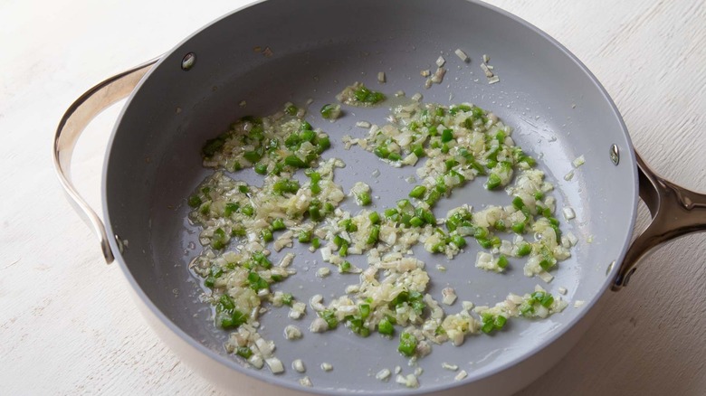 minced vegetables sauteeing in skillet