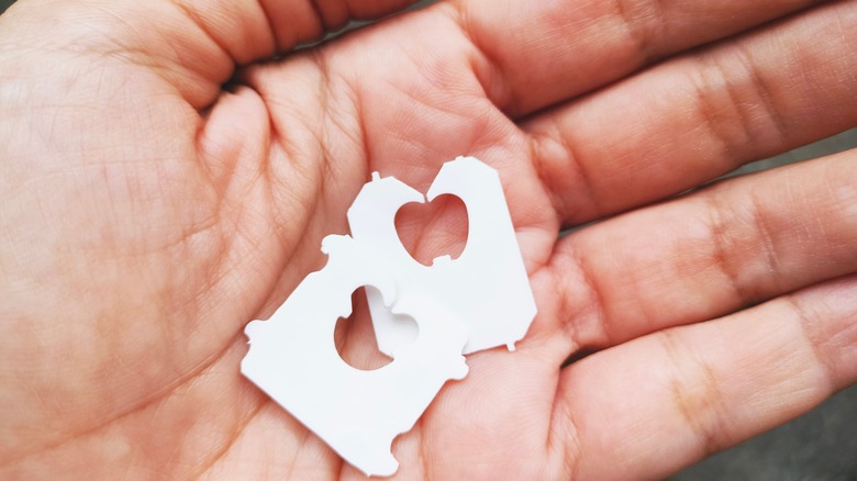 Hand holding bread tags