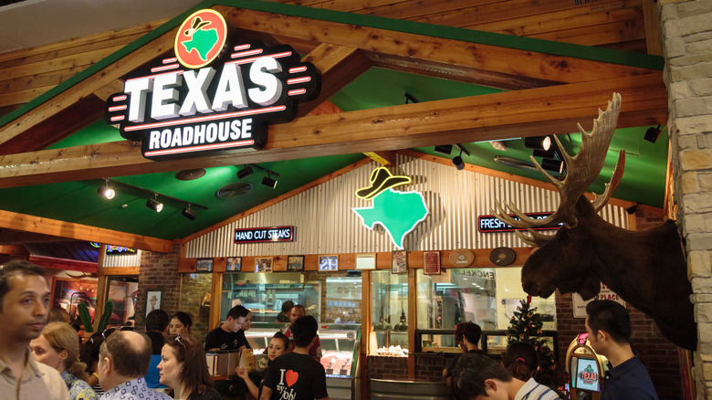 Interior shot of a busy Texas Roadhouse restaurant dining room