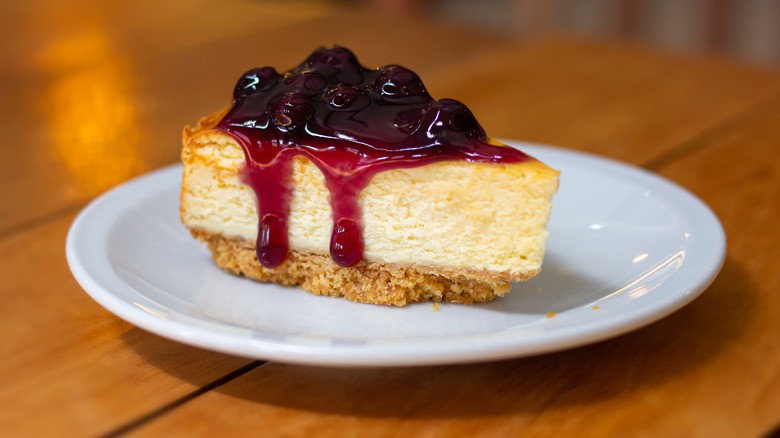 slice of new York style cheesecake on plate