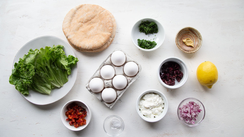 eggs, cottage cheese, pita bread, and assorted produce