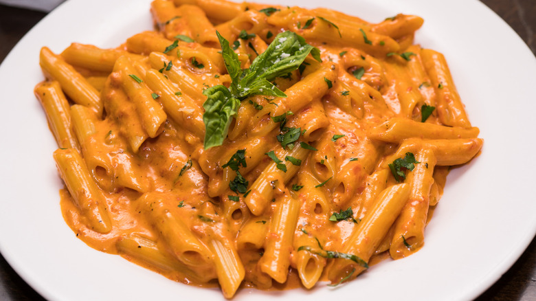 Close-up of penne alla vodka in a white bowl