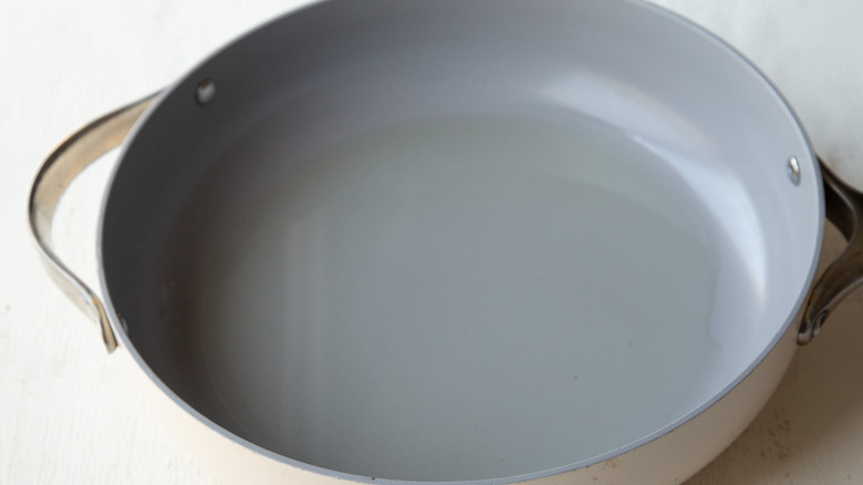white frying pan with grey interior